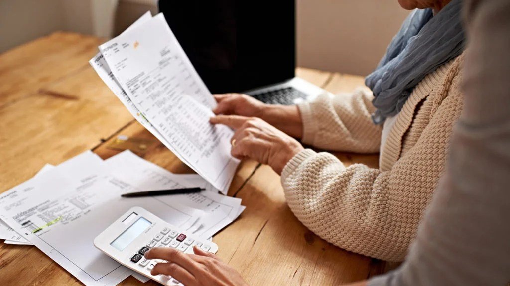 people looking at bills for medicare supplement plan j